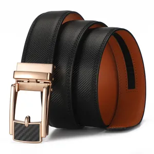 Detail of men's leather click belt with gold carbon fiber buckle and orange inner lining