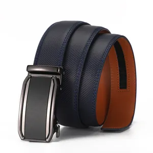Detail of navy blue textured leather belt with modern metal automatic buckle and brown lining