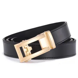 Detail of men's black leather belt featuring a brushed gold automatic metal buckle