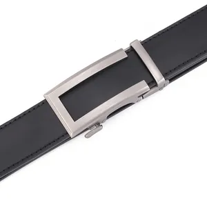 Detail of men's leather belt with brushed silver automatic buckle and black stitching