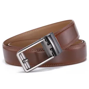 Close-up of brown leather belt with fine double stitching and brushed metal buckle