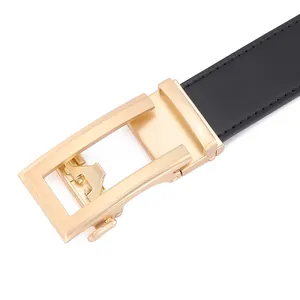 Detailed macro shot of a black leather belt with golden brushed metal automatic buckle