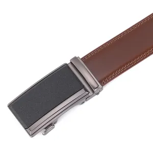 Close-up of brown leather belt with matte grey automatic buckle and double stitching