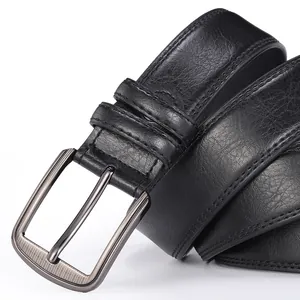Macro shot of men's black leather belt with brushed metal buckle and double stitching detail