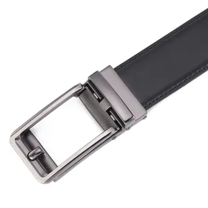 Detail of genuine black leather belt with gunmetal automatic buckle and brushed finish