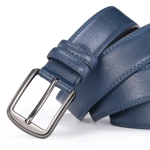 Close-up of navy blue leather belt showing metal pin buckle and double-stitch detailing