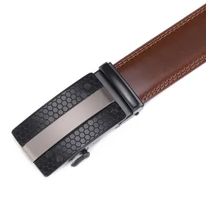 Detail of brown leather belt with double stitching and black honeycomb automatic buckle
