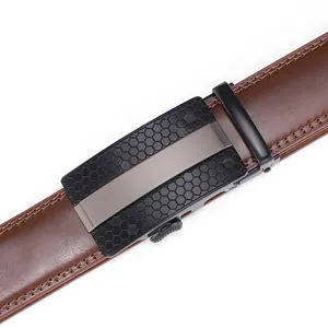 Close-up of brown leather belt with honeycomb textured alloy automatic buckle detail