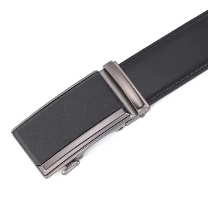 Detailed macro shot of a men's black leather belt with grey alloy automatic buckle closure
