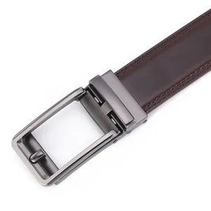 Close-up of men's dark brown leather belt with gunmetal automatic buckle and fine stitching