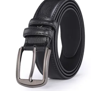 Detail of black leather belt showing metal pin buckle and textured lychee pattern leather