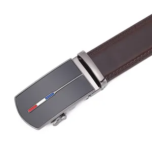 Detail of premium brown leather belt with matte gunmetal automatic buckle and fine stitching