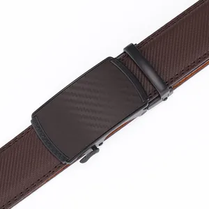 Detail of automatic buckle with carbon fiber texture and Greek key pattern on leather belt