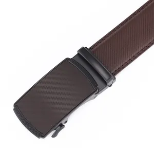 Detail of blue leather belt with carbon fiber texture automatic buckle and greek key pattern