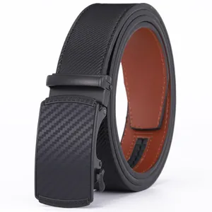 Close-up of black automatic buckle with carbon fiber texture and Greek key pattern edge