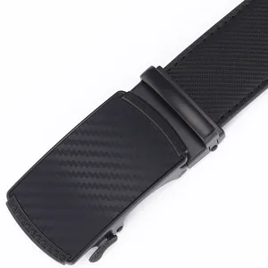 Detail of automatic buckle with carbon fiber texture and Greek fret pattern on black belt