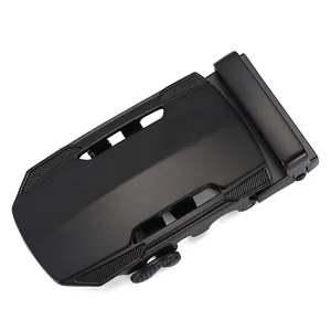 Close-up of matte black automatic belt buckle with precision engraved side texture