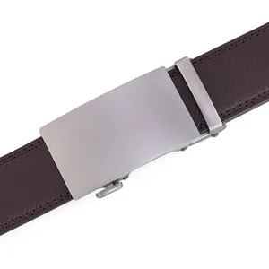 Macro detail of men's genuine leather belt featuring cross-hatch texture and brushed buckle