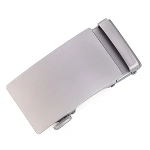 Detail of automatic belt buckle in brushed gunmetal finish with release lever