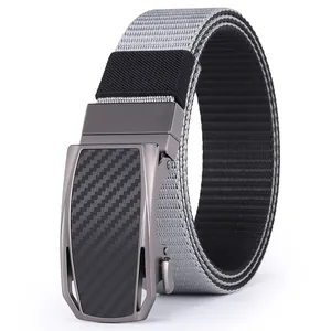 Macro shot of gray nylon tactical belt with carbon fiber texture automatic metal buckle