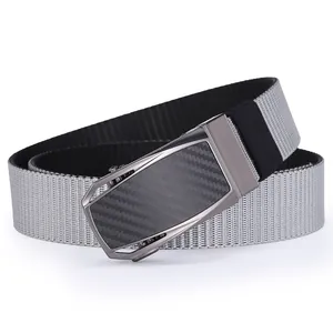 Close-up of dual-tone nylon belt with carbon fiber texture on metal automatic buckle
