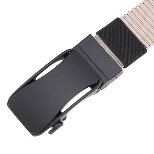 Detail of matte black metal automatic buckle on a beige woven canvas tactical belt