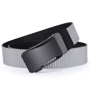 Close-up of the rotatable matte black metal buckle on a woven canvas tactical belt