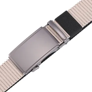 Macro detail of gunmetal grey automatic buckle and striped nylon tactical belt strap