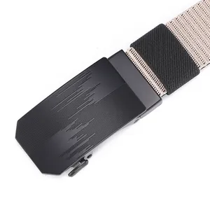 Macro shot of matte black automatic buckle with khaki nylon woven belt webbing