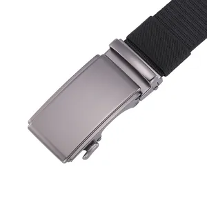 Close-up macro detail of men's durable nylon canvas belt with a gray automatic metal buckle