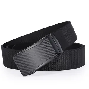 Detailed shot of men's nylon belt featuring a black automatic buckle with carbon fiber texture