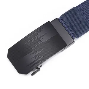 Close-up of matte black metal automatic buckle with textured navy nylon woven belt