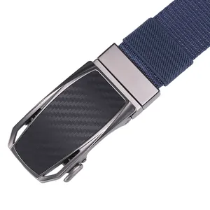 Detail of automatic buckle with carbon fiber texture and blue woven nylon strap belt