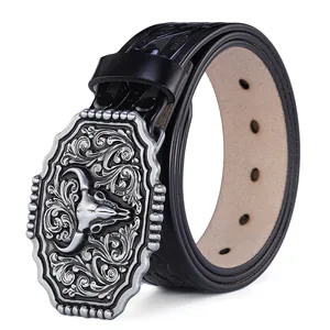 Detail of western belt with bull skull buckle and geometric embossed black leather