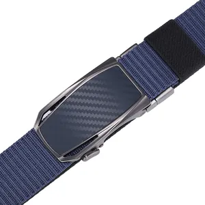 Detailed close-up of dark blue nylon belt with automatic carbon fiber texture buckle