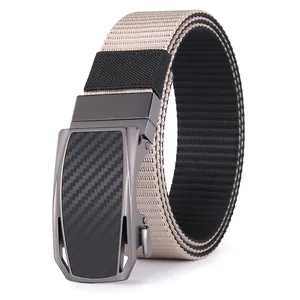 Detail of automatic buckle with carbon fiber texture and two-tone nylon tactical belt