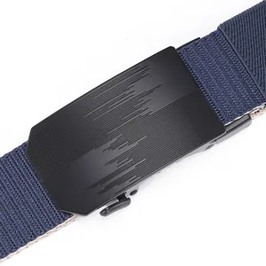Close-up of matte black automatic buckle and navy nylon woven belt texture