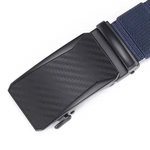 Macro shot of men's automatic buckle with carbon fiber texture and navy woven belt