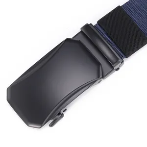 Close-up of matte black metal automatic buckle and navy blue nylon woven belt