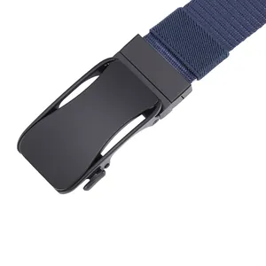 Detailed close-up of matte black metal automatic buckle and navy woven canvas belt