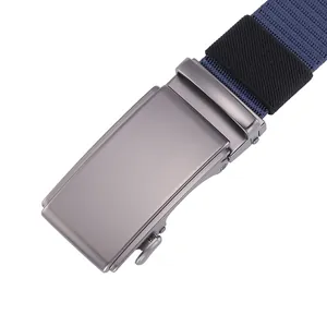 Close-up of matte gunmetal automatic buckle and navy blue nylon woven belt texture