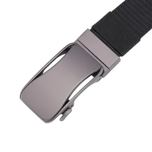 Macro shot of gun-gray metal automatic buckle and black woven tactical belt texture