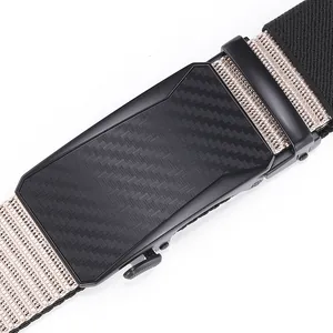 Macro detail of tactical belt featuring carbon fiber buckle and khaki nylon braided strap