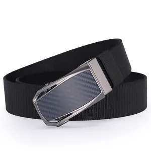 Detail of black nylon woven belt featuring a carbon fiber texture automatic metal buckle