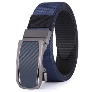 Detail of navy nylon strap with gunmetal automatic buckle featuring carbon fiber texture