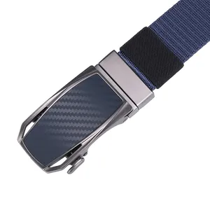 Detail of navy nylon belt with gun-metal automatic buckle and blue carbon fiber inlay