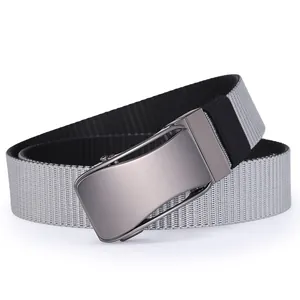 Detail of grey tactical canvas belt showing brushed gunmetal buckle and woven texture