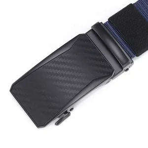 Detail of matte black metal automatic buckle with carbon fiber texture and nylon belt strap