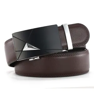 Macro shot of men's brown leather belt with lychee texture and matte black automatic buckle