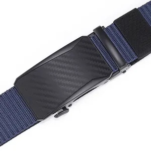 Macro view of men's woven belt with carbon fiber texture buckle and blue-black twill strap